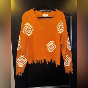 Impressions Burnt Orange V-Neck Sweater with Geometric Patterns